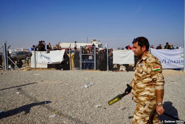 Entrance to the Khasir camp as displaced civilians wait to enter, 2016.